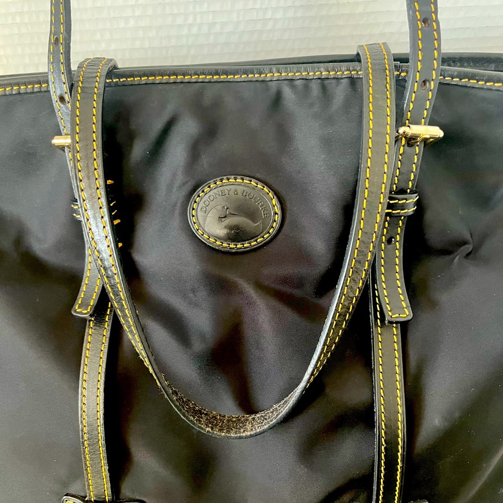 Dooney & Bourke Black Nylon East West Shopper with leather trim and tan accents.